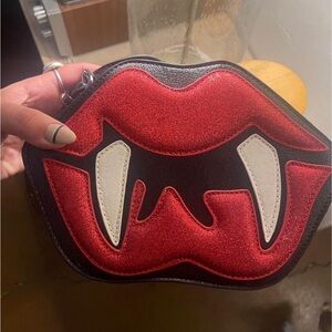 gothic or alternative style, vampire, lips and fangs crossbodys purse. Halloween